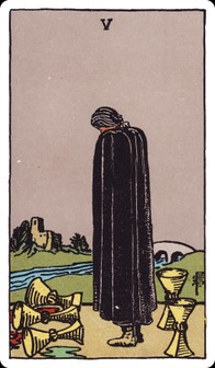 Rider–Waite–Smith Five of Cups: a mourning figure in a black cloak before three spilled cups, two upright cups behind.