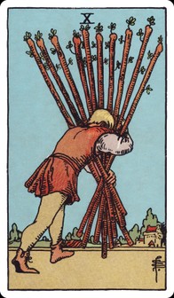 Ten of Wands tarot card: a bent figure carries ten heavy staves toward a distant town.