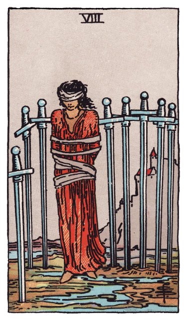 Eight swords stand behind and beside a bound, blindfolded figure, the ground open in front and a castle on a distant hill.